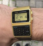 RELOJ CALCULADORA CASIO VINTAGE DBC-611G-1DF DATABANK DORADO